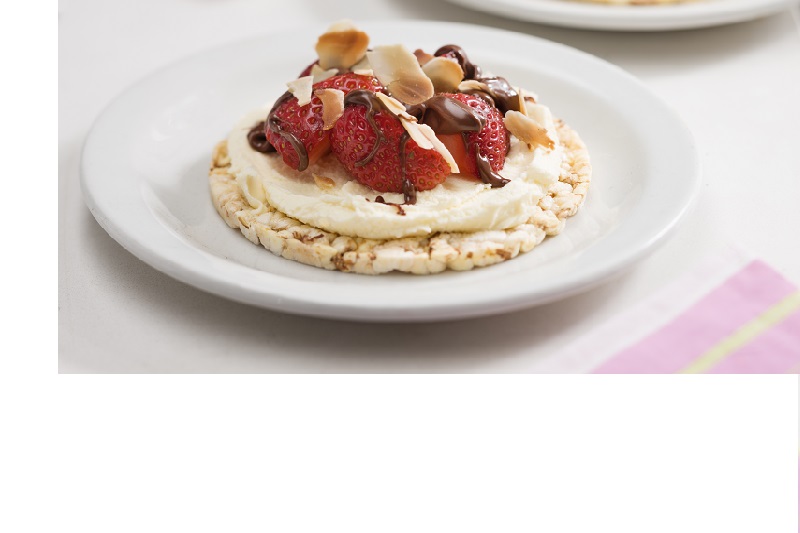 Delicious sweet snack or dessert of chocolate spread (Nutella) fresh strawberries, mascarpone & sliced roast almonds