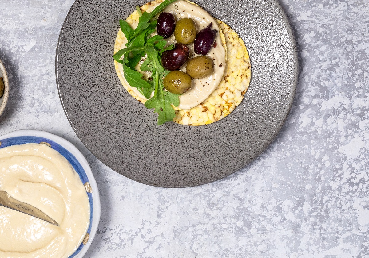 Hommus, Olives & Rocket on CORN THINS slices for lunch