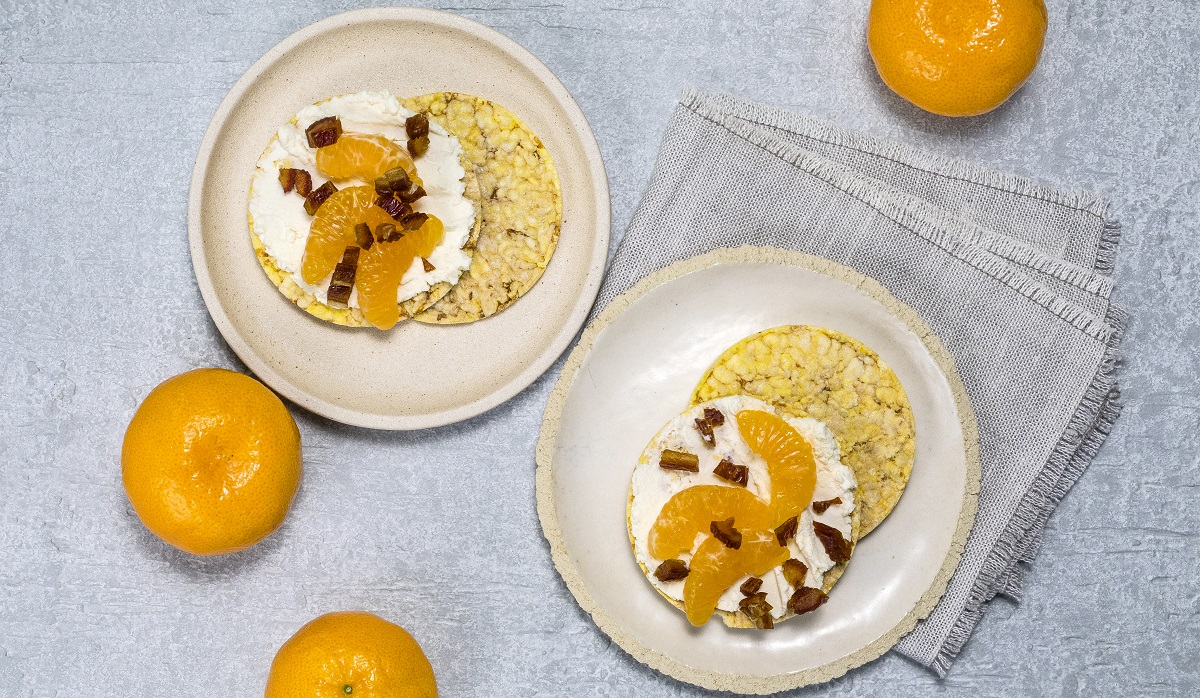 Ricotta, Mandarin, & chopped dates on CORN THINS slices