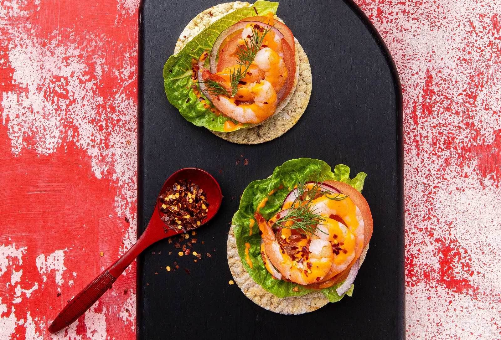 Prawns, Sriracha Mayo, Red Onion, Lettuce & Chilli Flakes on CORN THINS slices