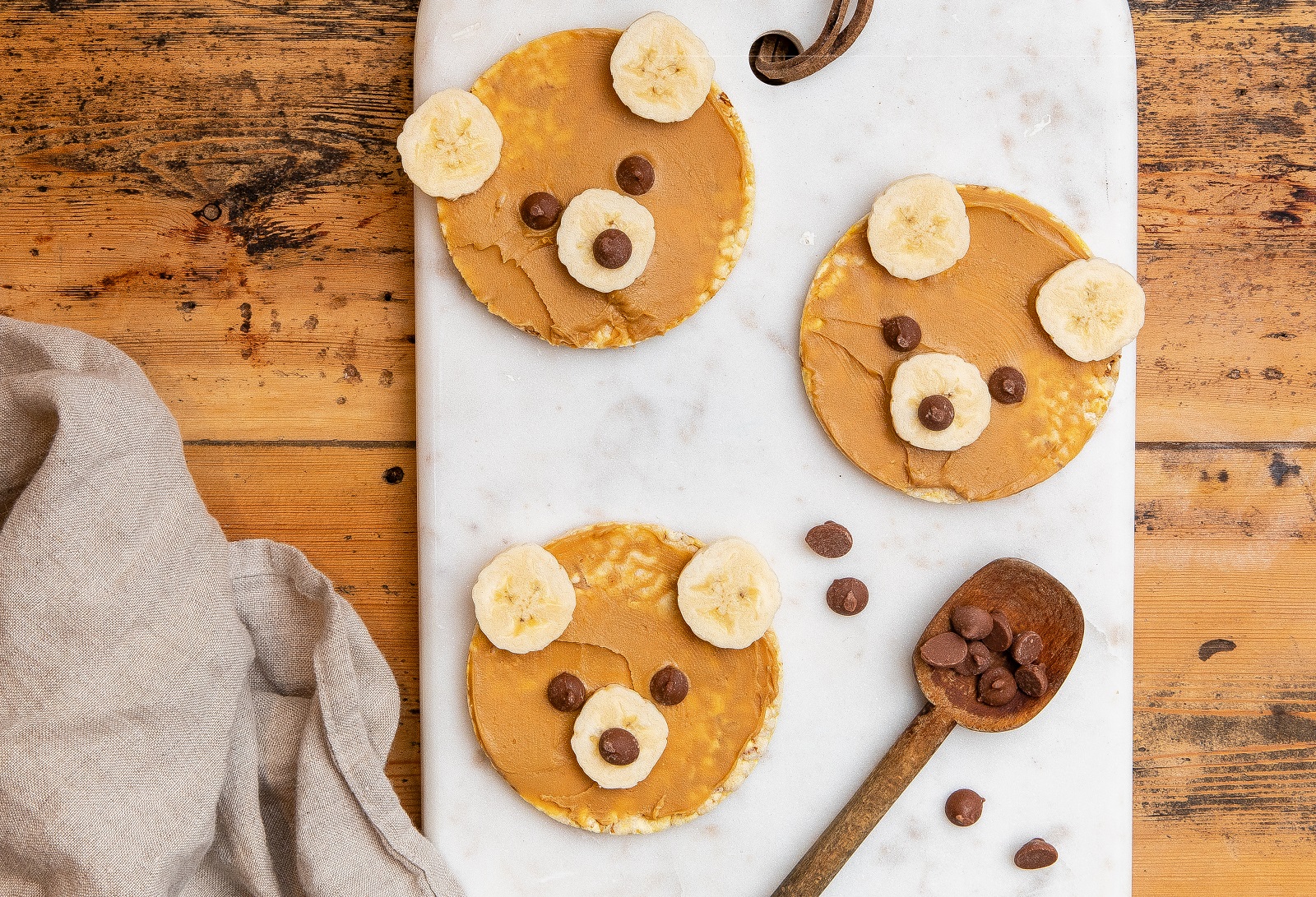 Fun Teddy Bears made from CORN THINS slices, banana, choc chips & nut butter