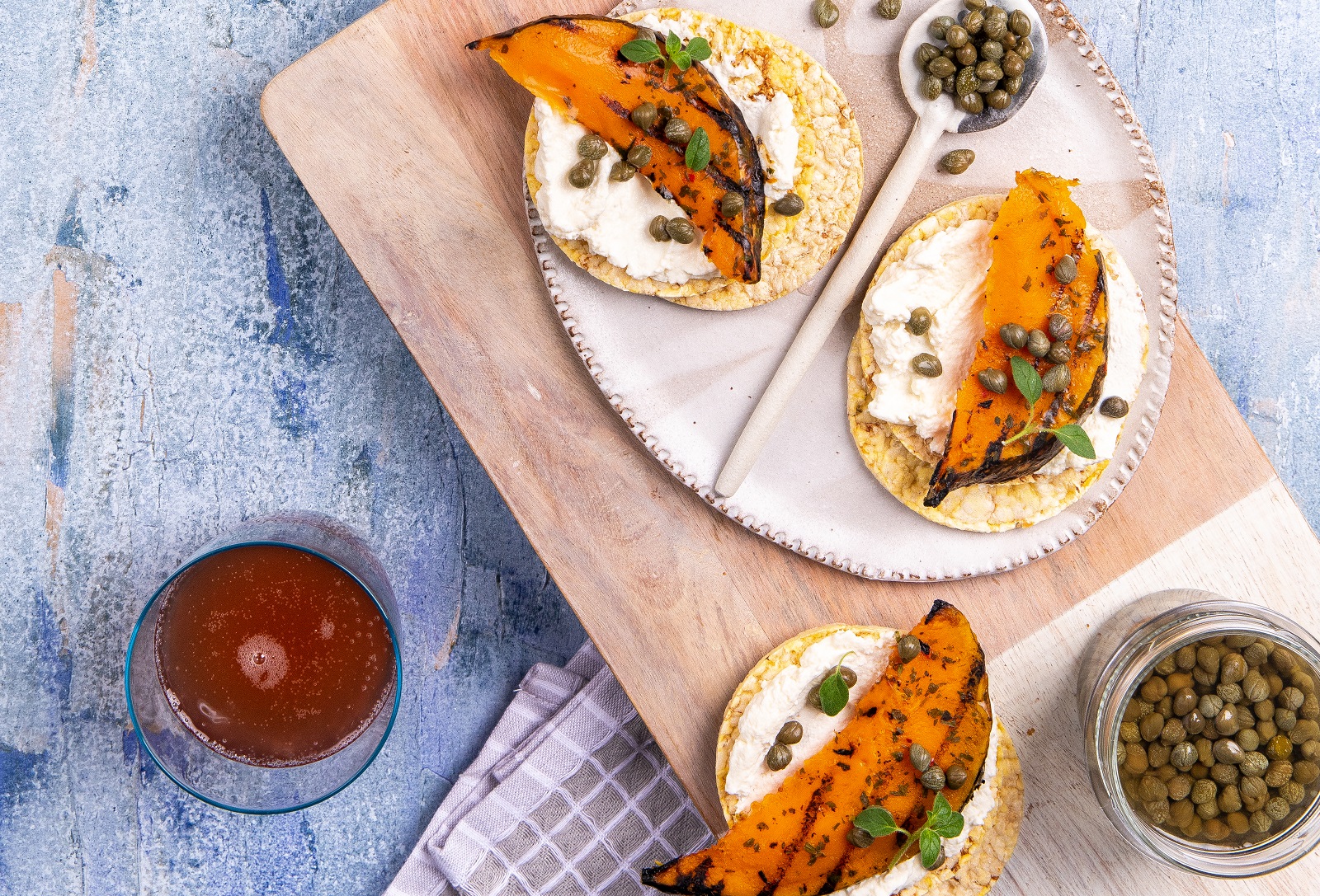 Leftover Roast Pumpkin, Ricotta & Capers on Corn Thins slices