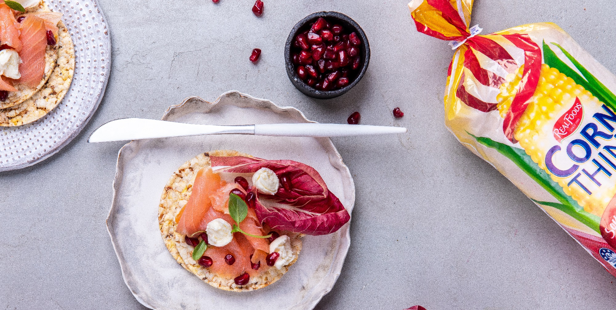 Smoked salmon, bocconcini, basil & pomegranate on Corn Thins slices