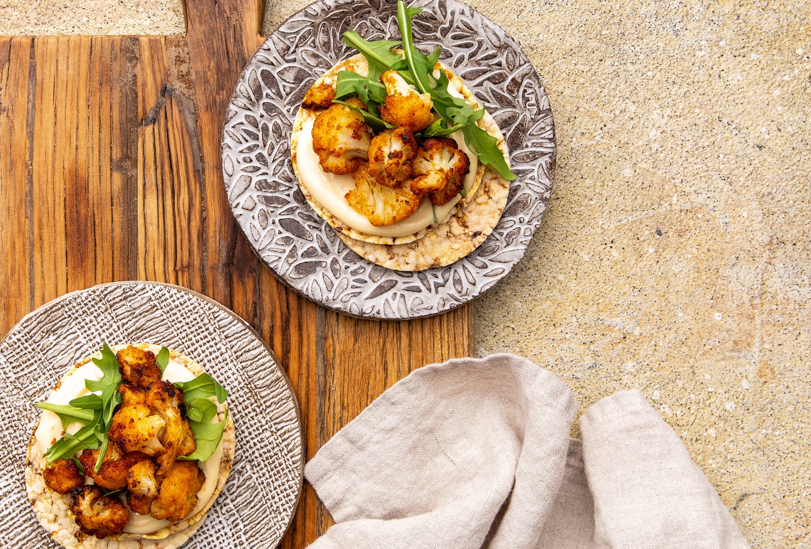 Aioli, Rocket & Spiced Roasted Cauliflower on Corn Thins slices for dinner