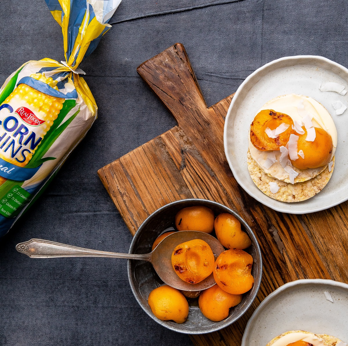 Grilled apricot, cream cheese & coconut flakes on Corn Thins slices