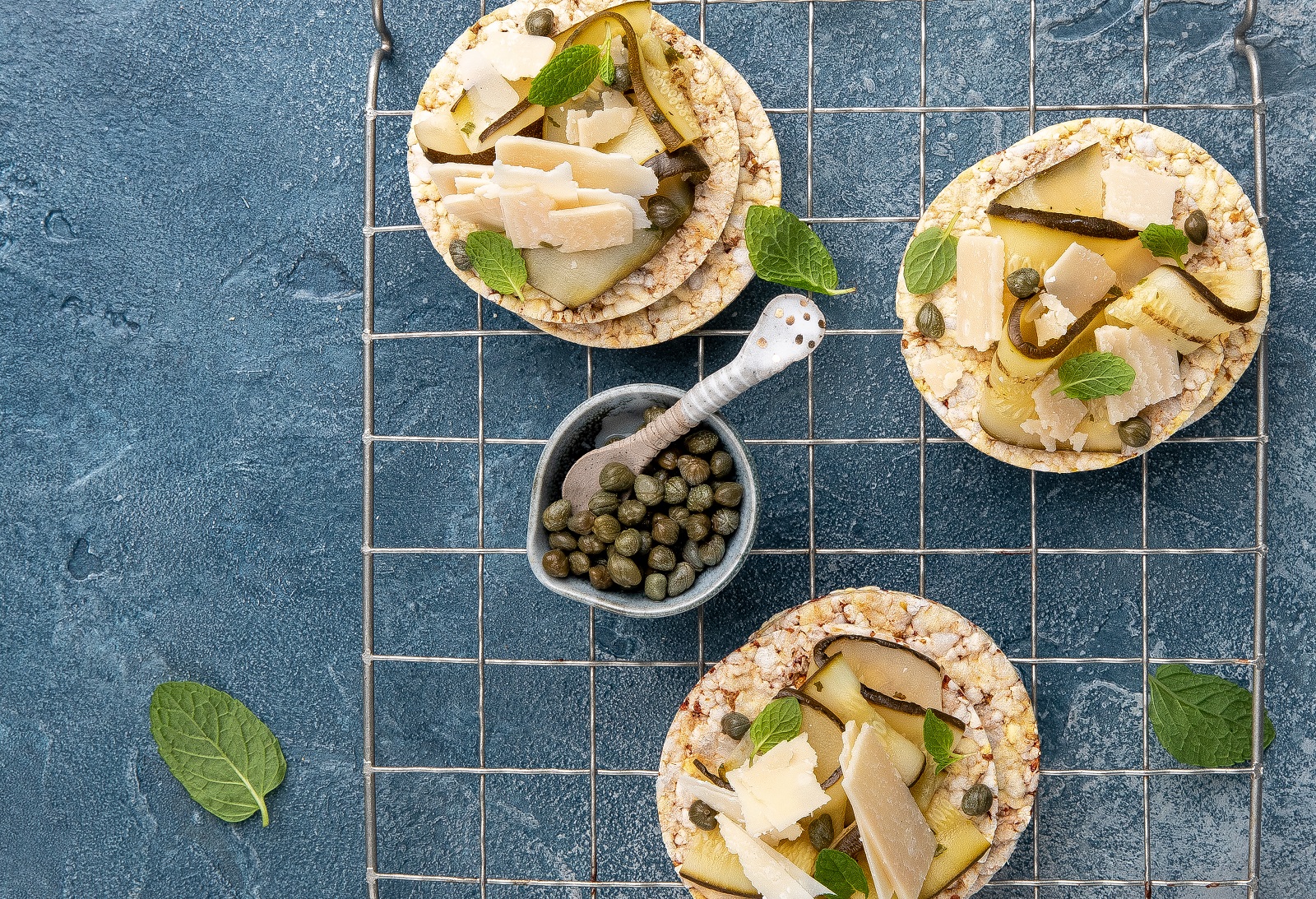 Grilled Zucchini, Parmesan, Capers & Mint on Corn Thins slices