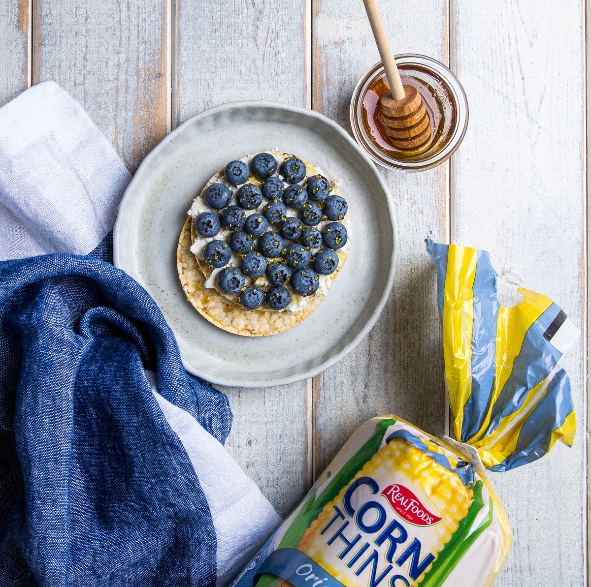 ricotta, blueberries, & honey on Corn thins slices