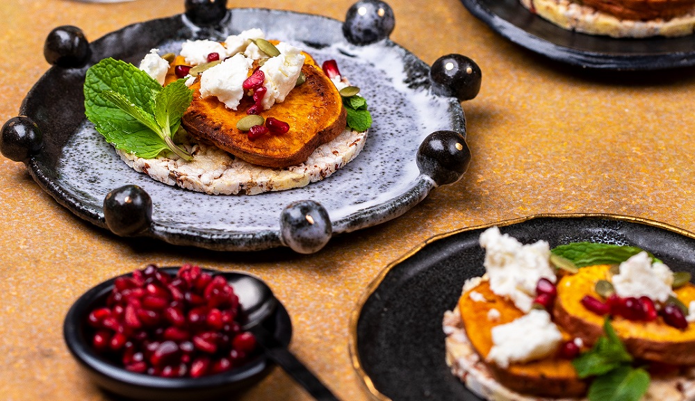 Baked sweet potato, mint, pomegranate, pepita & feta on CORN THINS slices