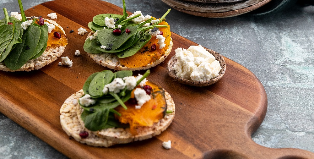 Pumpkin, baby spinach, goat's cheese & pomegranate on Corn Thins slices