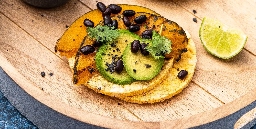 Roast pumpkin, avocado, black beans & coriander on Corn Thins slices