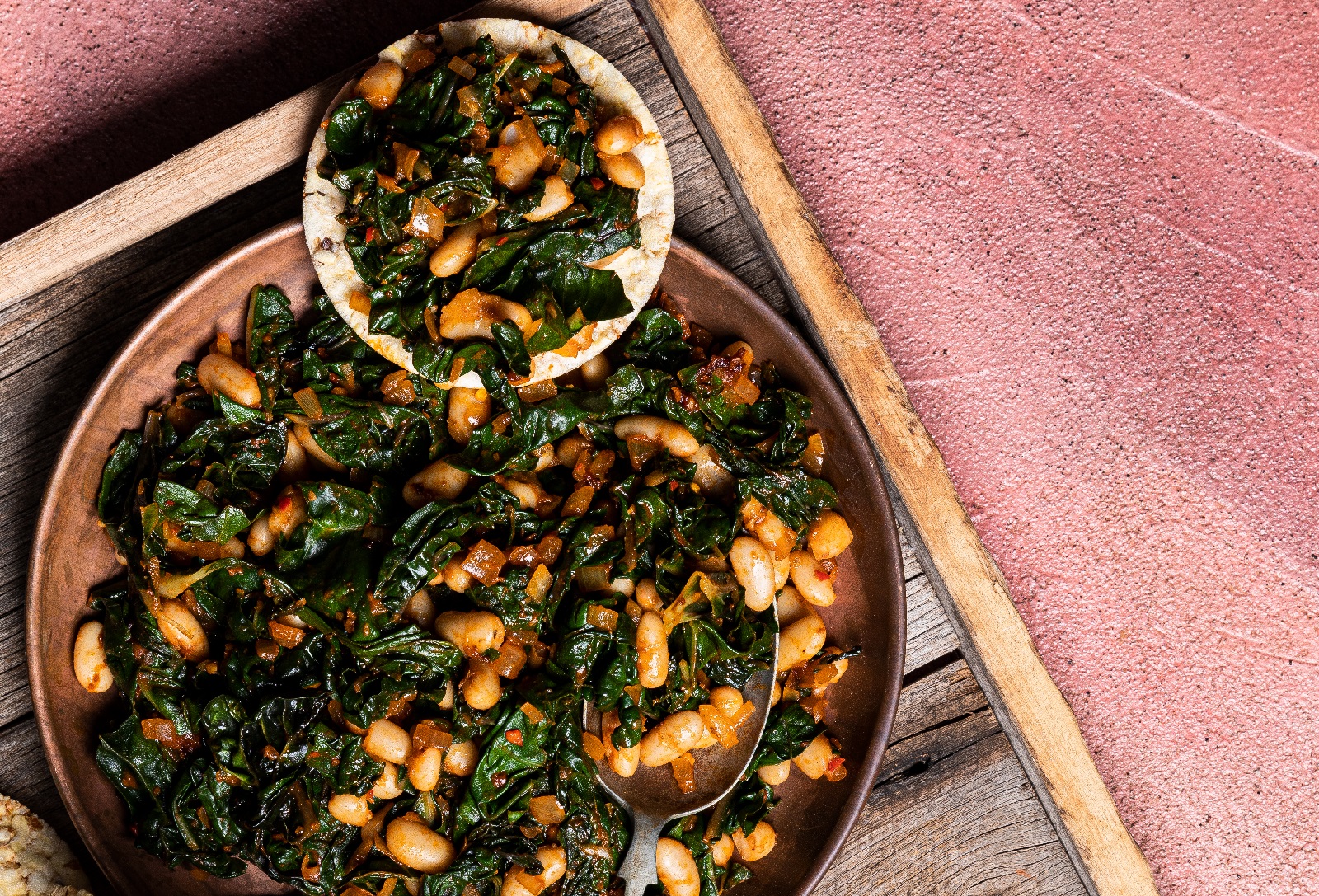 Moroccan Spiced Silverbeet & White Beans on Corn Thins slices