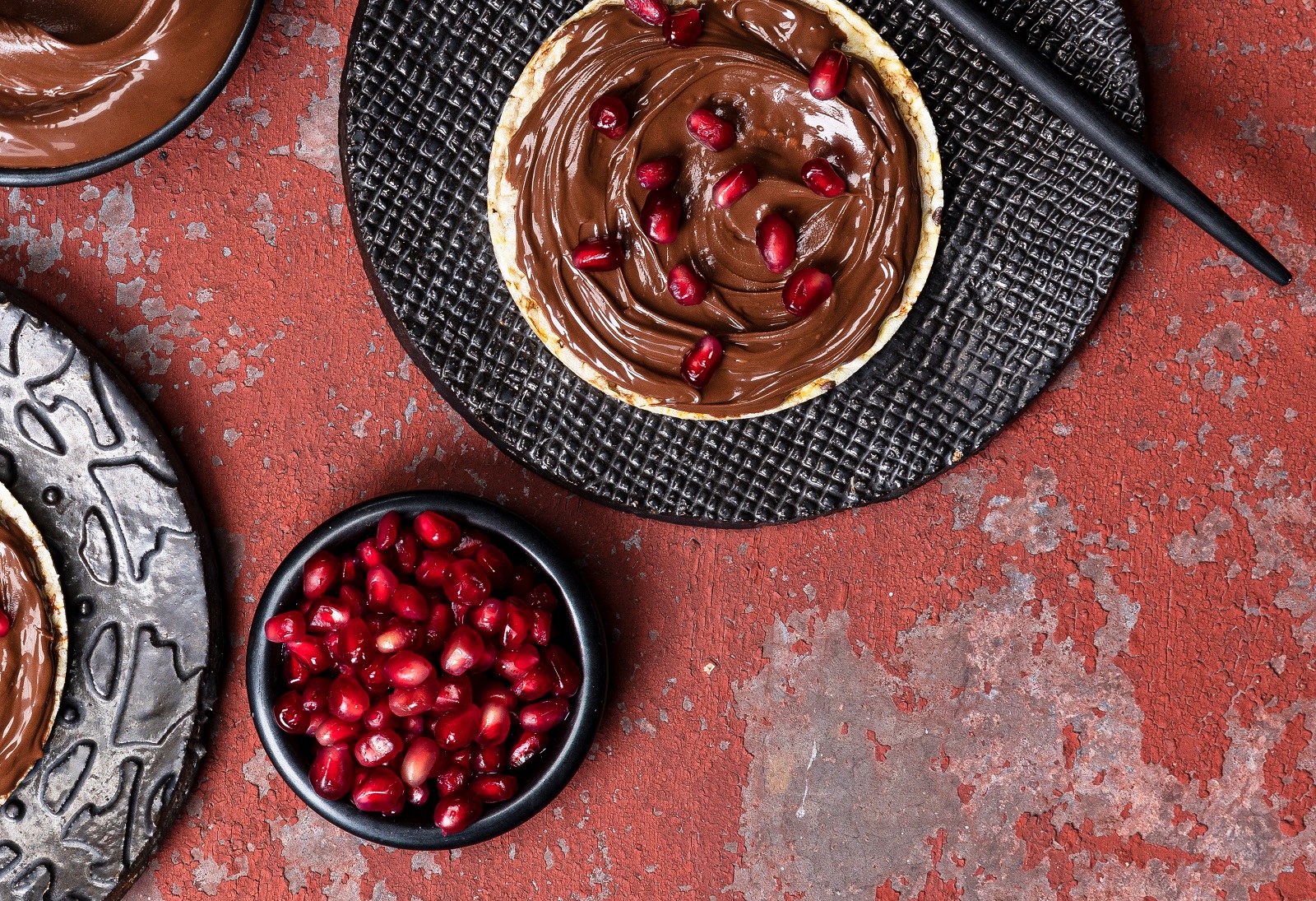 Nutella & Pomegranate on Corn Thins slices