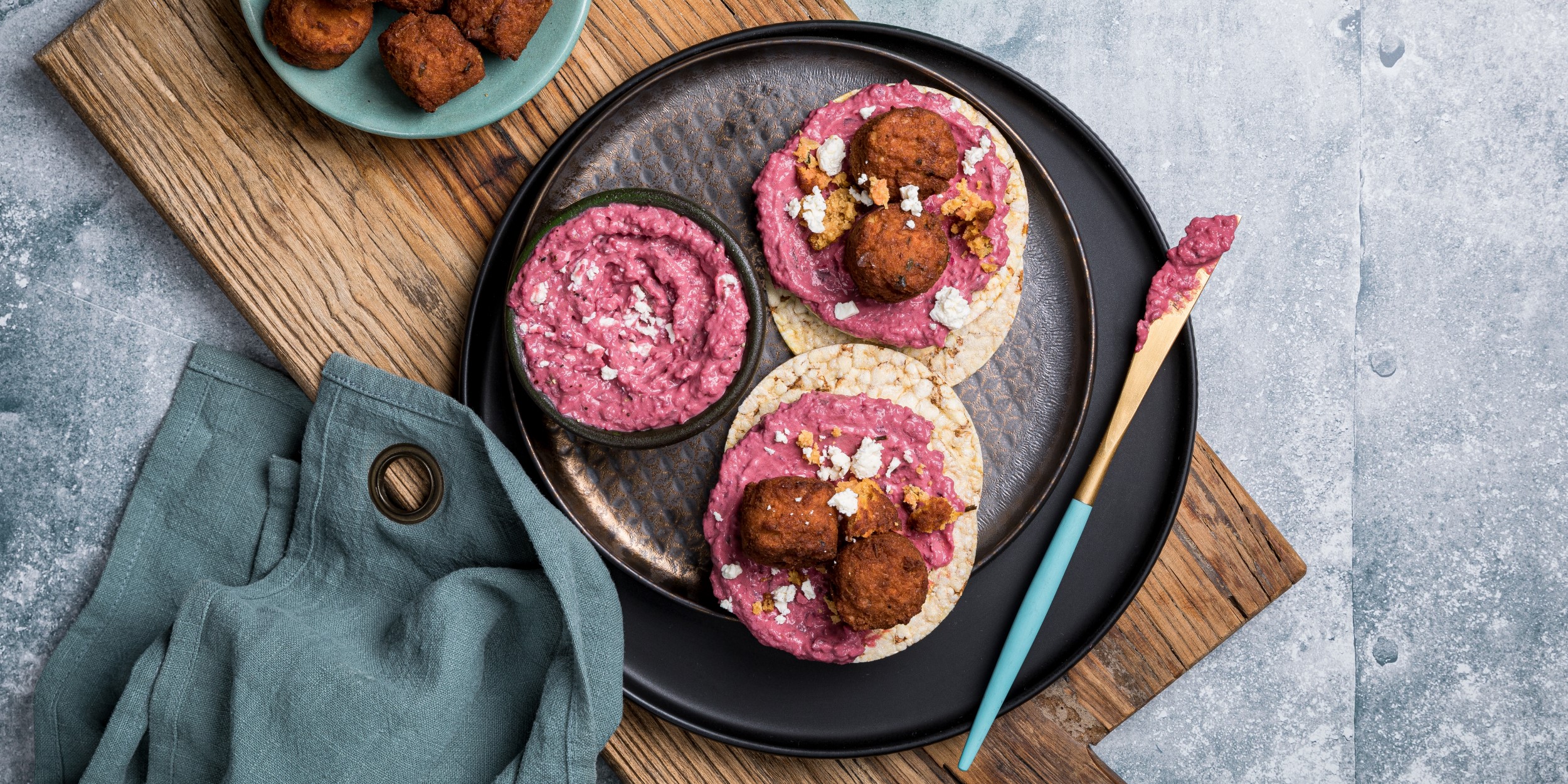 Beetroot hommus, vegie bites & fetta on Corn Thins slices