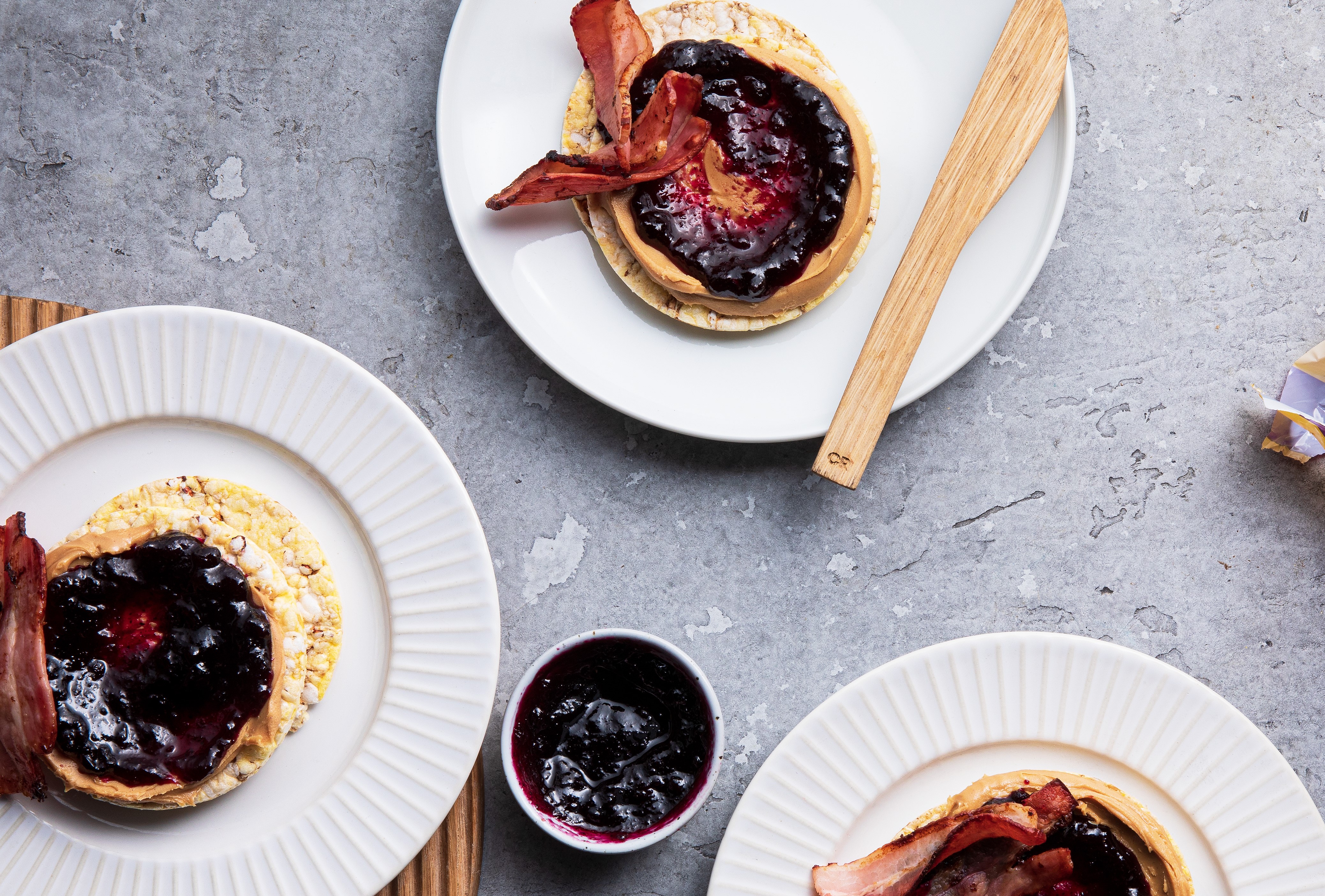 Peanut Butter, Blueberry Conserve & Bacon on Corn Thins slices
