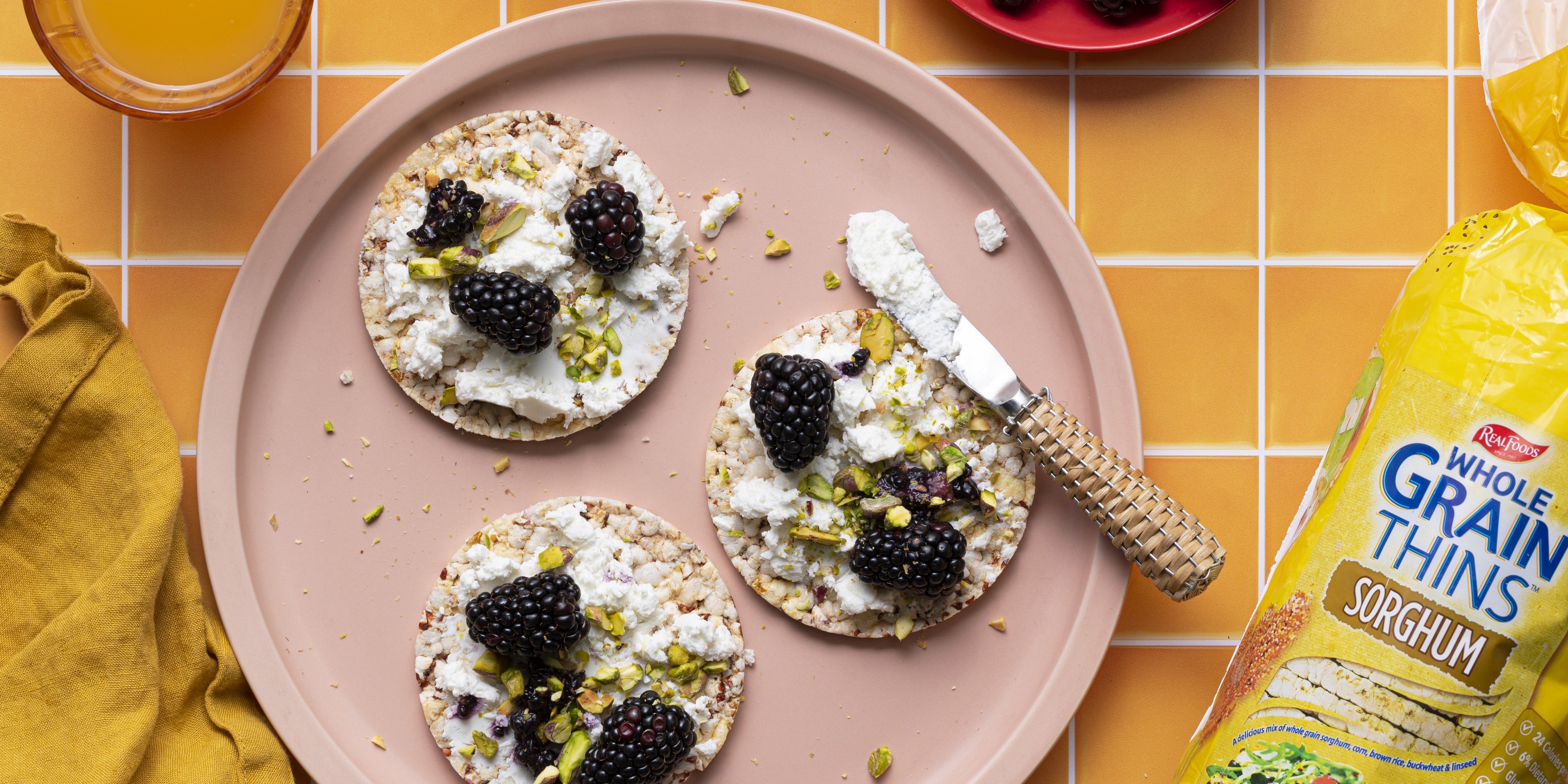 Goats Cheese, blackberry, pistachio on Corn Thins slices