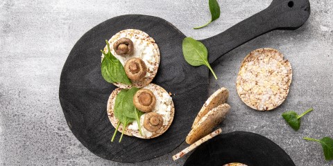 Goats cheese, marinated mushrooms & baby spinach on Corn Thins slices