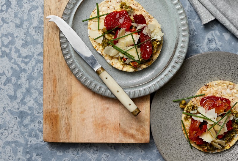 Pesto, Confit Tomato, Parmesan & Chives on Corn Thins slices