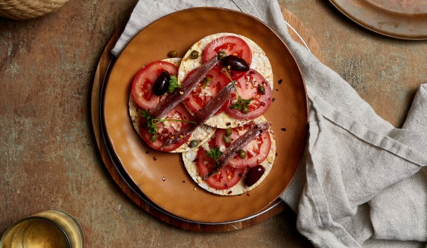 Tomato, garlic, capers, anchovy & parsley on Corn Thins slices