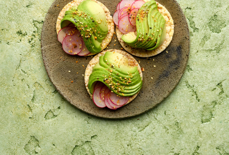 Avocado, radish, extra virgin olive oil & dukkah on Corn Thins slices