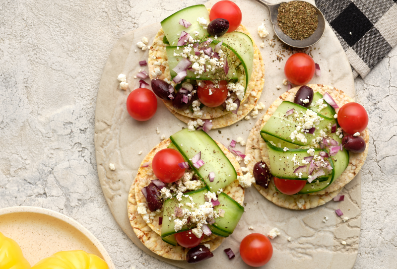 Greek Salad (Cherry Tomatoes, cucumber, onion, fetta, olives) on Corn Thins slices