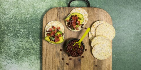 Avocado, Tomato, Black Beans and coriander on Corn Thins slices