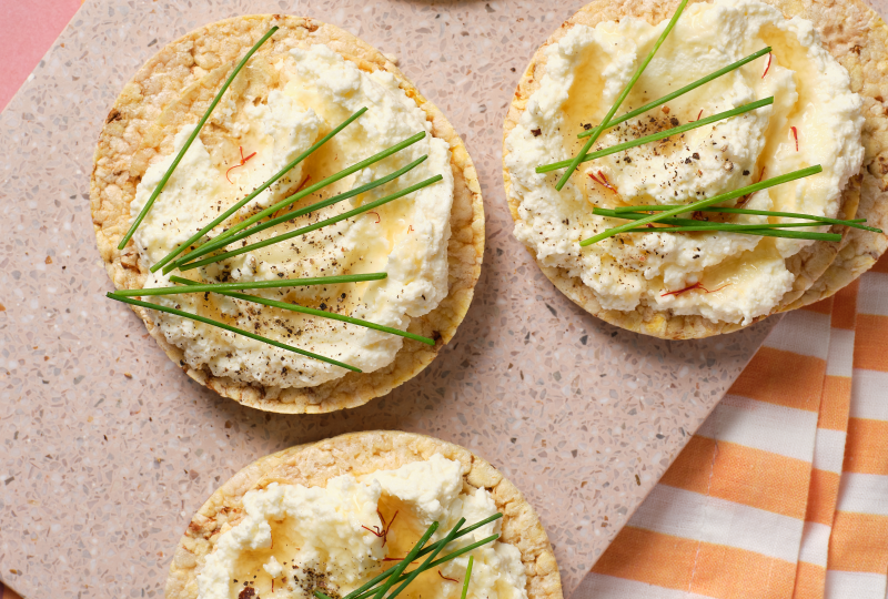 Ricotta, Saffron Infused Honey, Chives & Pepper on Corn Thins slices