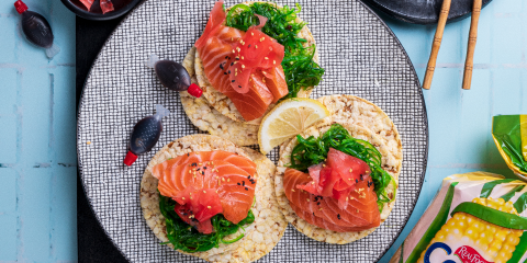 Seaweed salad, Salmon sashimi, pickled ginger & sesame seeds on Corn Thins slices