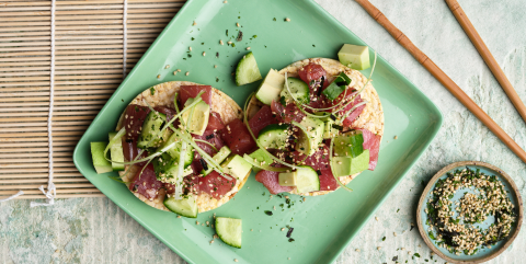 Poke with tuna, avo, cucumber, spring onion & furikake on Corn Thins slices