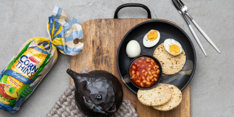 Baked beans & boiled egg of Corn Thins slices for breakfast