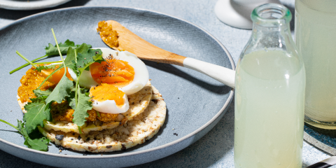 honey mustard, boiled egg, rocket on Corn Thins slices