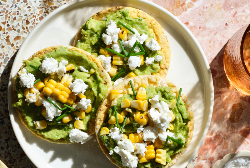 Smashed Avo, Charred Corn, Goats Cheese & Chives on Corn Thins slices