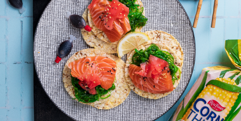 Seaweed salad, Salmon sashimi, pickled ginger & sesame seeds on Corn Thins slices