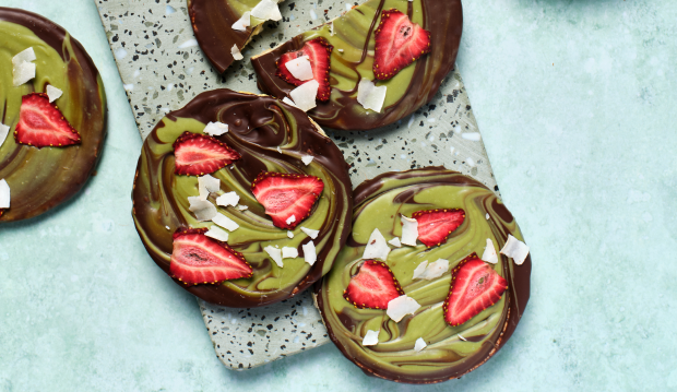 Dark choc, matcha white choc, freeze dried strawberries & Coconuts on Corn Thins slices