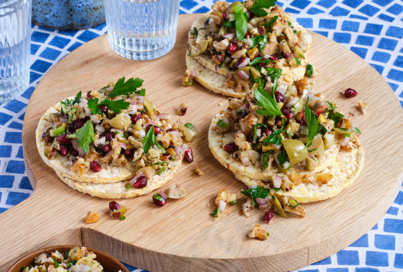 Green Olive, Walnut & Pomegranate Salad on Corn Thins slices
