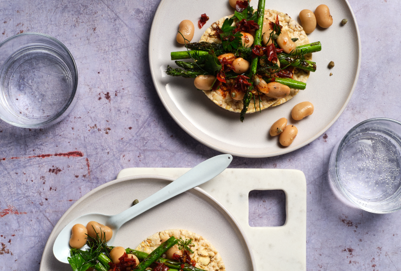 Grilled Asparagus, Butter Beans. Herbs & Chilli Oil on Corn Thins slices