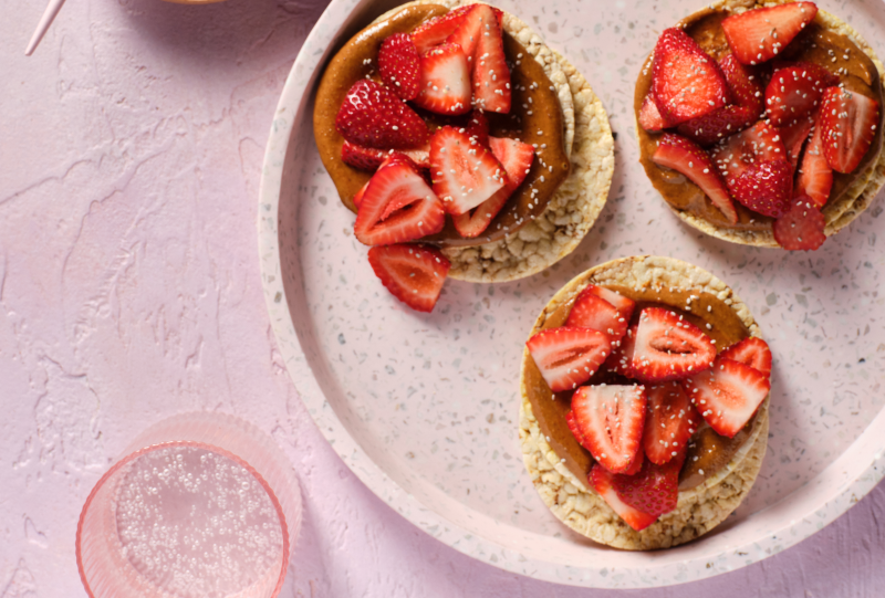 Almond butter, strawberries & Chia seeds on Corn Thins slices