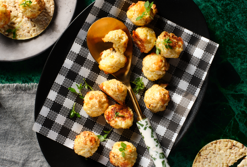 Baked Cauliflower Pieces with Cheese on Corn Thins Slices