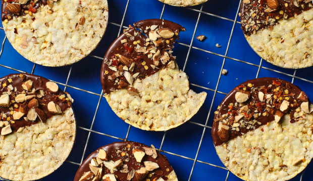 Corn Thins slices dipped in dark chocolate, with crushed almonds & chilli flakes
