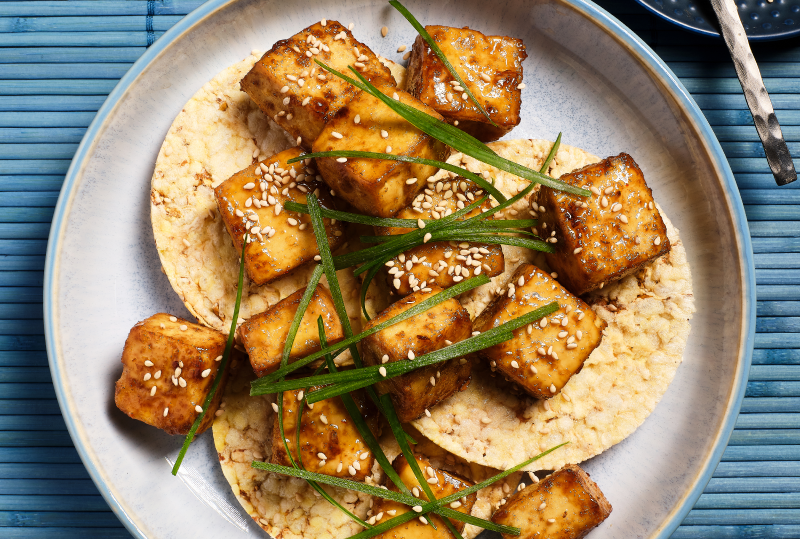 Hot Honey Tofu, Spring Onions & Sesame on Corn Thins slices