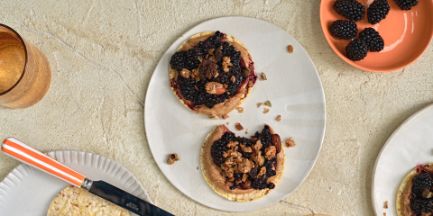 Almond butter, smashed blackberries & Granola on Corn Thins slices