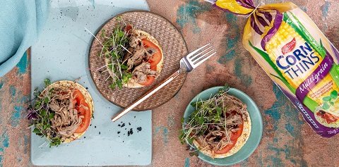 Roma tomato, micro greens & pulled pork on Corn Thins slices