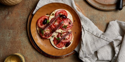 tomato, garlic, capers, anchovy & parsley on Corn Thins slices