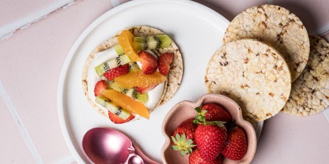 whipped cream, orange, kiwifruit & strawberry on Corn Thins slices