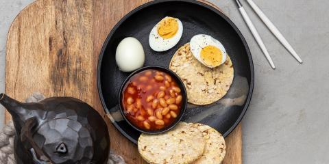 Beans & eggs with Corn thins slices for breakfast