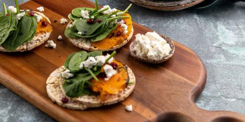 Roast Pumpkin, Baby Spinach, Goat Cheese & Pomegranate on Corn Thins slices