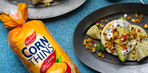 Avocado wedges, grilled corn, Caesar dressing & chilli on Corn Thins slices