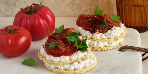 Cottage cheese, confit tomato and parsley on Corn Thins slices
