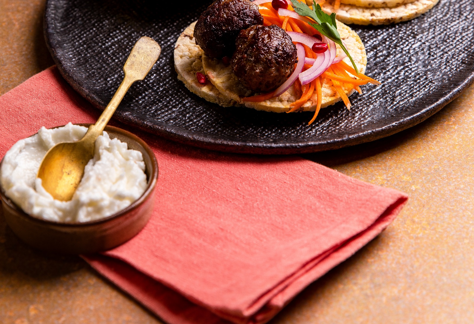 Lamb Kofta, Carrot, Red Onion, Pomegranate & Garlic Sauce on Corn Thins slices for dinner