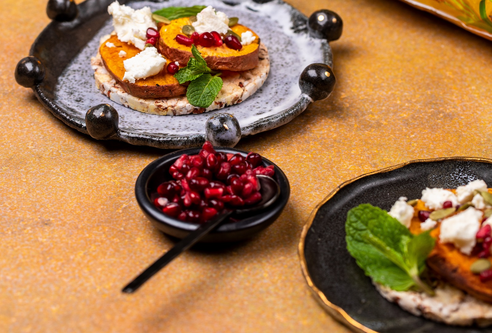 Baked Sweet Potato, Mint, Pomegranate, Pepita & Feta on CORN THINS slices (vegetarian)