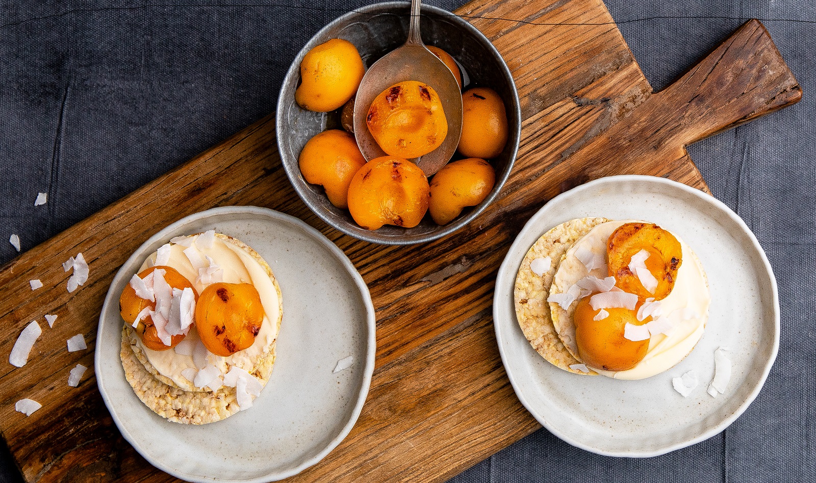 Corn Thins slices with grilled apricot, cream cheese & coconut flakes